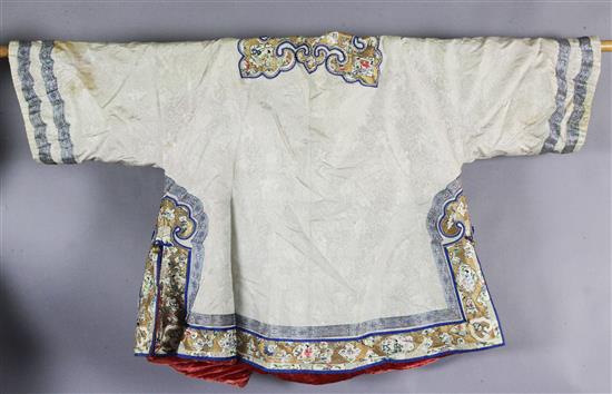 A Chinese embroidered cream silk and russet velvet robe, early 20th century, length 81cm